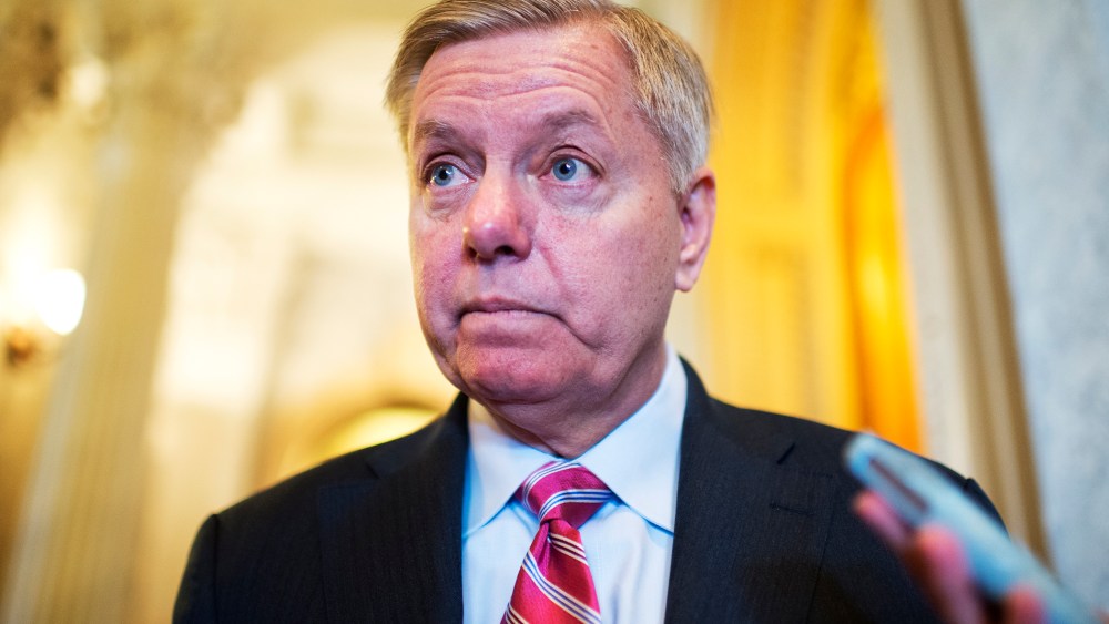 Sen. Lindsey Graham, R-S.C., talks with reporters in the Capitol during a vote on unemployment benefits, Jan. 7, 2014.