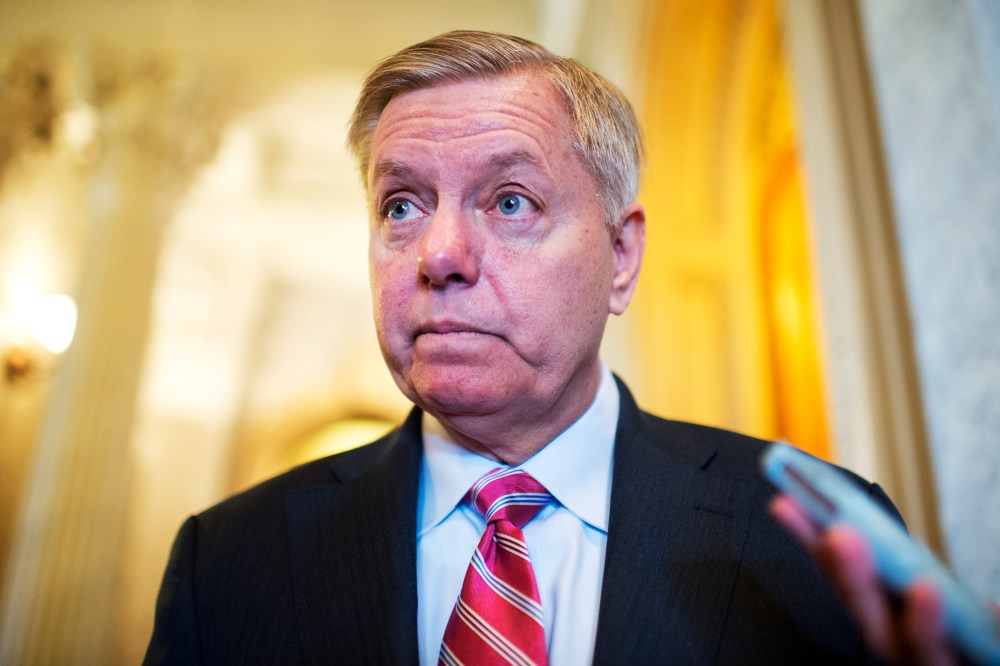 Sen. Lindsey Graham, R-S.C., talks with reporters in the Capitol during a vote on unemployment benefits, Jan. 7, 2014.