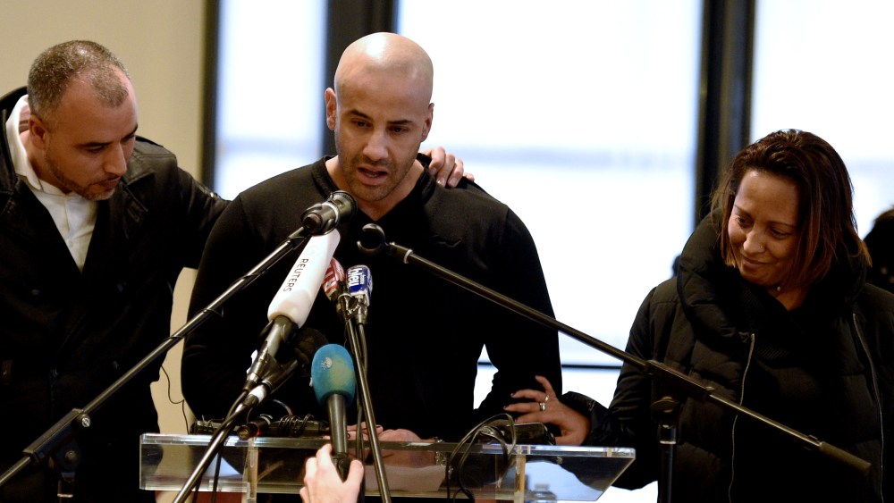 Malek Merabet (C), brother of slain policeman Ahmed Merabet, during a press conference in Livry-Gargan, a Paris suburb, on Jan. 10, 2015 with Ahmed's brother-in-law Lotfi Mabrouk (L), and Ahmed's partner Morgane. (Photo by Martin Bureau/AFP/Getty)