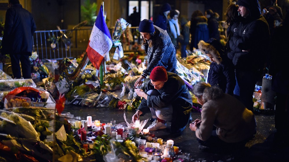 Members of the public light candles in tribute near the offices of French satirical magazine Charlie Hebdo on Jan. 10, 2015 in Paris, France. (Photo by Jeff J Mitchell/Getty)