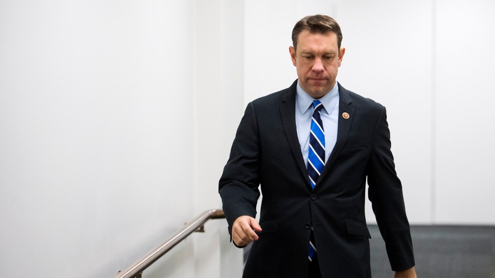 Trey Radel leaves the House Republican Conference meeting in the basement of the Capitol, Jan. 8, 2014.