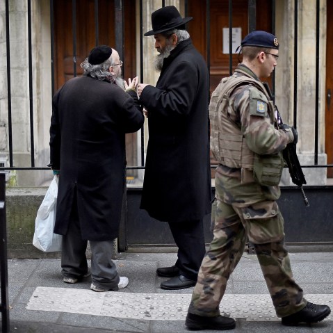 Armed security patrol outside a Jewish School in the Jewish quarter of the Marais district on Jan. 12, 2015 in Paris, France