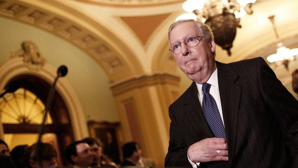 Senate Majority Leader Mitch McConnell (R-KY) arrives to take questions from members of the press following a weekly policy luncheon with Senate Republicans at the U.S. Capitol on Jan. 13, 2015 in Washington, D.C. (Photo by Win McNamee/Getty)