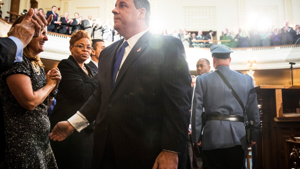 New Jersey Governor Chris Christie shakes hands with audience members before the annual State of the State address on Jan. 13, 2015 in Trenton, N.J. (Photo by Andrew Burton/Getty)
