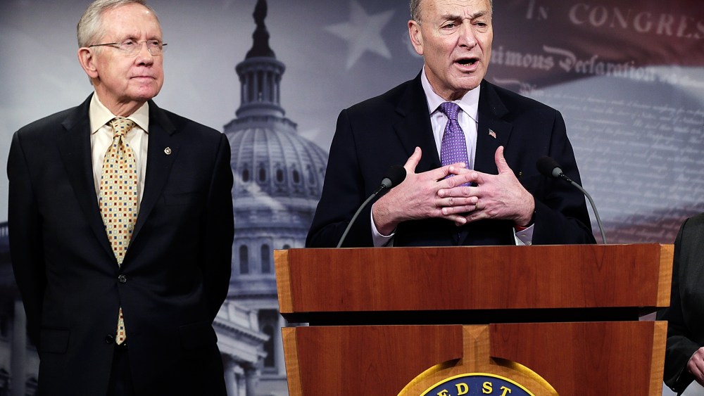 Sen. Chuck Schumer and Senate Majority Leader Harry Reid answer questions during a press conference Jan. 9, 2014.