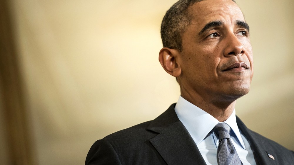 President Barack Obama pauses while speaking during an event in the East Room of the White House's private dining room Jan. 9, 2014 in Washington, D.C. (Photo by Brendan Smialowski/AFP/Getty)