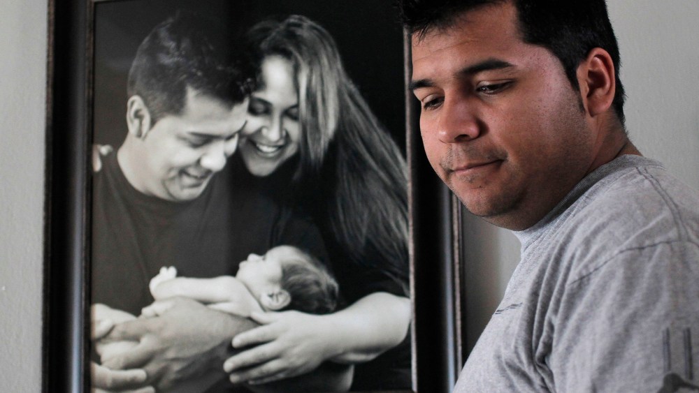 Erick Munoz, the husband of Marlise Machado Munoz, poses for a photo at his home on Jan. 3, 2014.