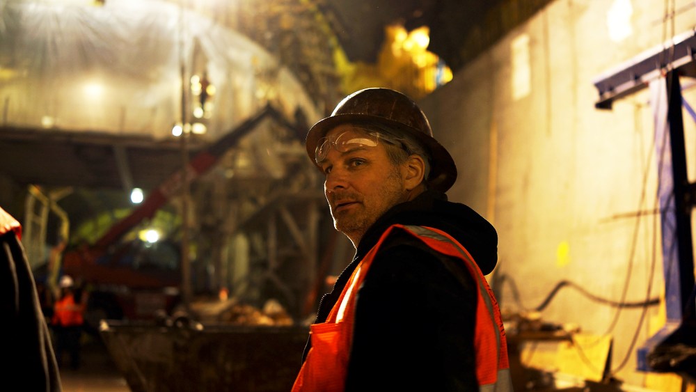 A construction worker pauses at the Second Avenue Subway project site in New York, Jan. 10, 2014.