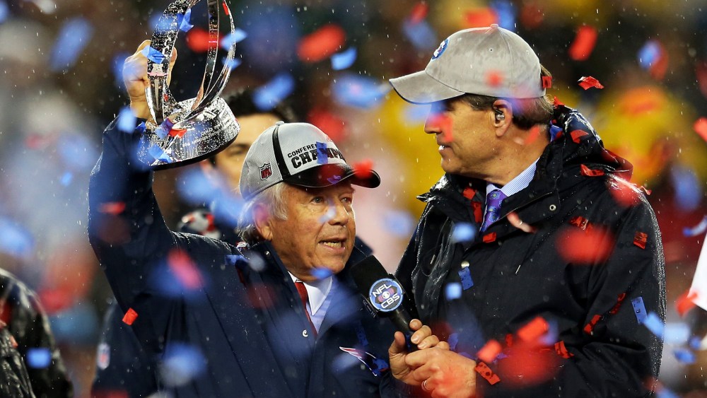 New England Patriots owner Robert Kraft holds up the Lamar Hunt Trophy after defeating the Indianapolis Colts in the 2015 AFC Championship Game at Gillette Stadium on Jan. 18, 2015 in Foxboro, Mass. (Photo by Jim Rogash/Getty)