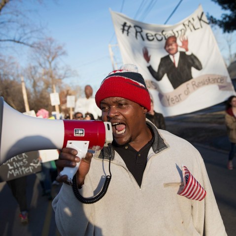 Demonstrators remember Michael Brown with a Martin Luther King Jr. Day march from the apartment complex where he was killed to the Ferguson police station on Jan. 19, 2015 in Ferguson, Mo. (Photo by Scott Olson/Getty)