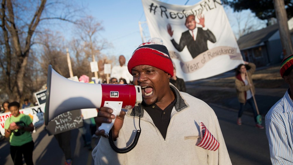 Demonstrators remember Michael Brown with a Martin Luther King Jr. Day march from the apartment complex where he was killed to the Ferguson police station on Jan. 19, 2015 in Ferguson, Mo. (Photo by Scott Olson/Getty)