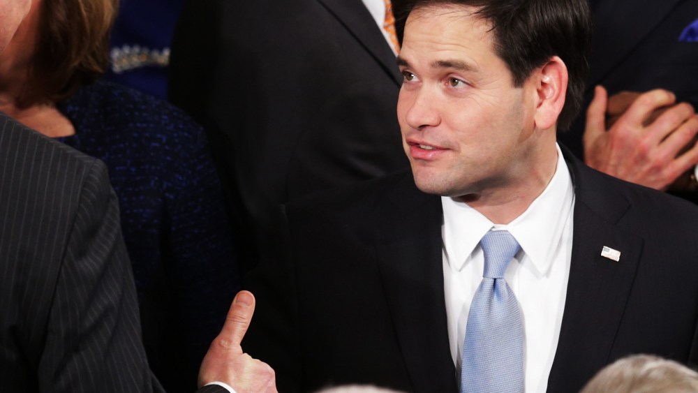 U.S. Sen. Marco Rubio (R-FL) (C) shakes hands before the start of the State of the Union speech in the House chamber of the U.S. Capitol on Jan. 20, 2015 in Washington, DC. (Photo by Alex Wong/Getty)
