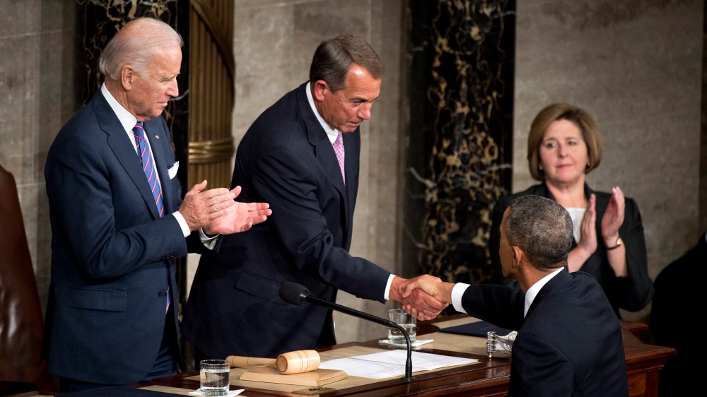 President Barack Obama greets Speaker John Boehner, R-Ohio, as Vice President Joe Biden looks on, in the Capitol's House chamber before Obama delivered his State of the Union address, Jan. 20, 2015. (Photo By Tom Williams/CQ Roll Call/Getty)