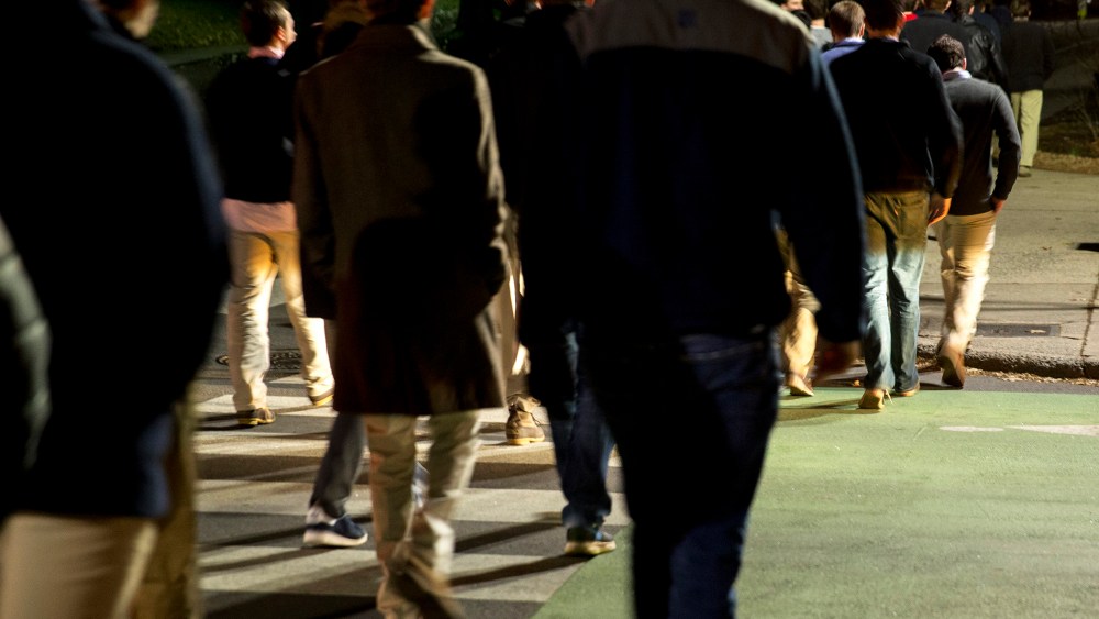 Students walk on Rugby Road towards fraternity houses during spring fraternity rush near the University of Virginia (UVA) campus in Charlottesville, Virginia, U.S., on Jan. 16, 2015. (Photo by Andrew Harrer/Bloomberg/Getty)