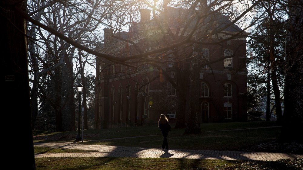 A student walks near Brooks Hall on the University of Virginia campus in Charlottesville, Va., on Jan. 17, 2015. (Photo by Andrew Harrer/Bloomberg/Getty)