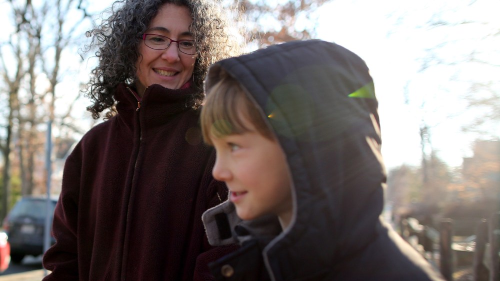 Danielle Meitiv waits with her son Rafi Meitiv, 10, for Danielle's daughter Dvora Meitiv, 6, to be dropped off at the neighborhood school bus stop in Silver Spring MD, on Jan. 16, 2015.