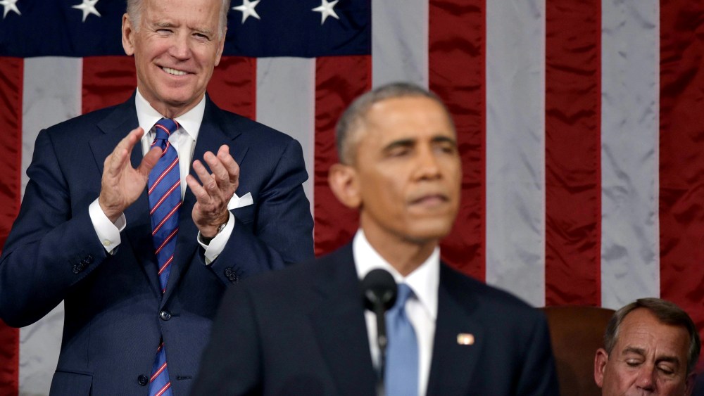 U.S. Vice President Joe Biden applauds President Barack Obama during the State of the Union address on Jan. 20, 2015 in the House Chamber of the U.S. Capitol in Washington, DC. (Photo by Mandel Ngan-Pool/Getty)