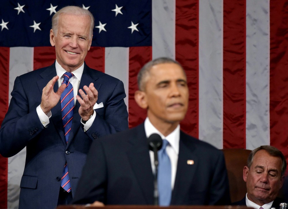 U.S. Vice President Joe Biden applauds President Barack Obama during the State of the Union address on Jan. 20, 2015 in the House Chamber of the U.S. Capitol in Washington, DC. (Photo by Mandel Ngan-Pool/Getty)