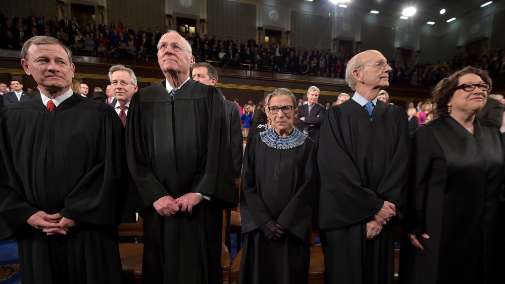 US Supreme Court Justices (L-R) John G. Roberts, Anthony M. Kennedy, Ruth Bader Ginsburg, Stephen G. Breyer and Sonia Sotomayor stand before the State of the Union address on Jan. 20, 2015 in Washington, DC. (Photo by Mandel Ngan-Pool/Getty)