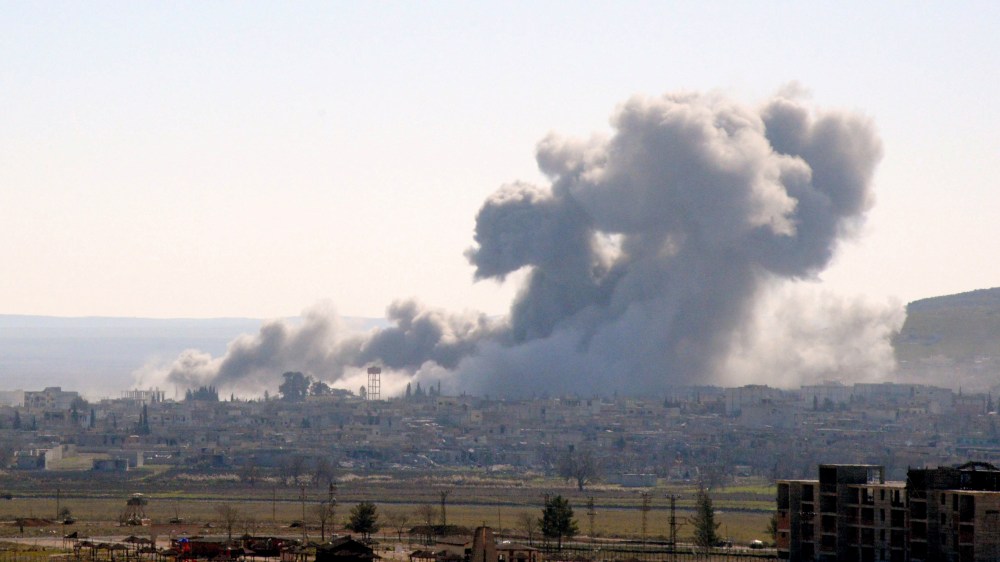 Smoke rising from the Syrian border town of Kobani (Ayn al-Arab) following the US-led coalition airstrikes against the Islamic State targets near Mursitpinar border crossing on Jan. 23, 2015 in Suruc, Turkey. (Photo by The Asahi Shimbun/Getty)
