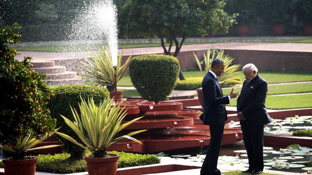 Indian Prime Minister Narendra Modi and US President Barack Obama talk in the gardens between meetings at Hyderabad House in New Delhi on Jan. 25, 2015. (Photo by Saul Loeb/AFP/Getty)