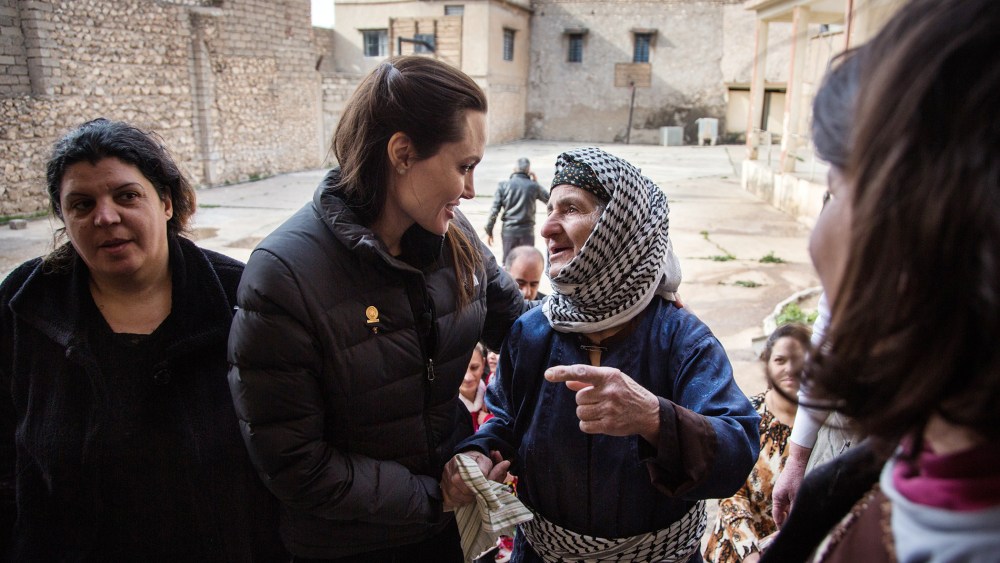 Angelina Jolie meets meets displaced Iraqis who are members of the minority Christian community, living in an abandoned school, on Jan. 26, 2015 in Al Qosh, Iraq. (Photo by Andrew McConnell/UNHCR/Getty)