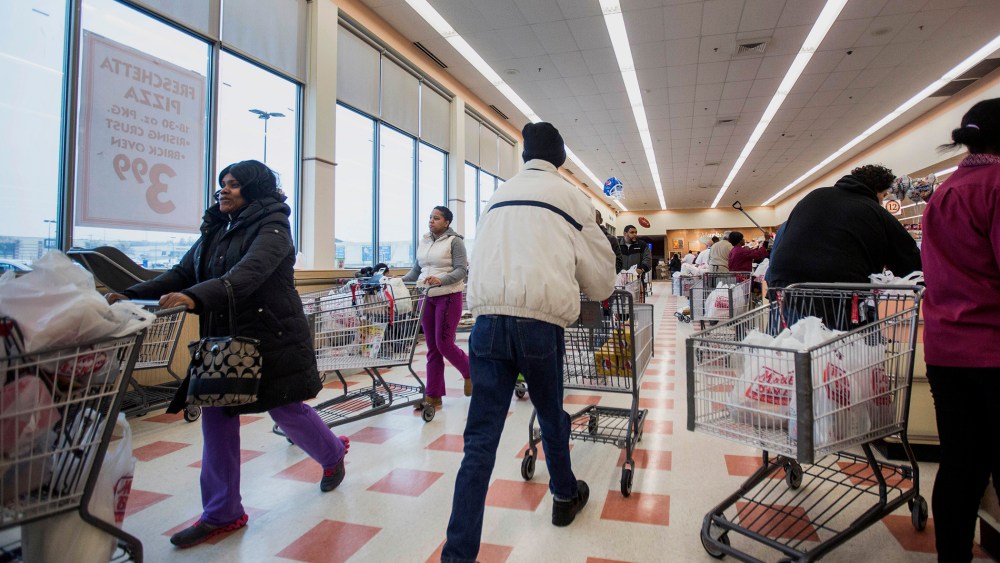 Customers push carts while stocking up for the storm at Market Basket in Brockton, Mass., on Jan. 26, 2015. (Photo by Scott Eisen/Bloomberg/Getty)