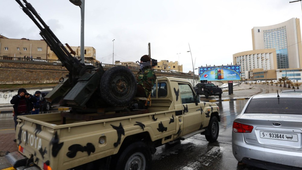 Libyan security forces surround Tripoli's central Corinthia Hotel (R) on Jan. 27, 2015 in the Libyan capital. (Photo by Mahmud Turkia/AFP/Getty)