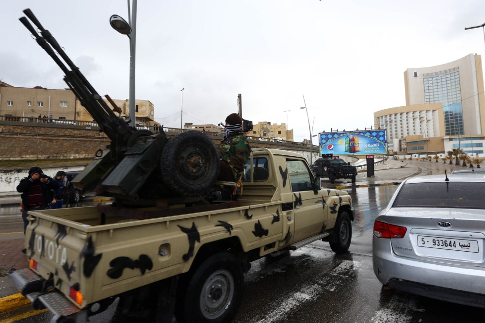 Libyan security forces surround Tripoli's central Corinthia Hotel (R) on Jan. 27, 2015 in the Libyan capital. (Photo by Mahmud Turkia/AFP/Getty)