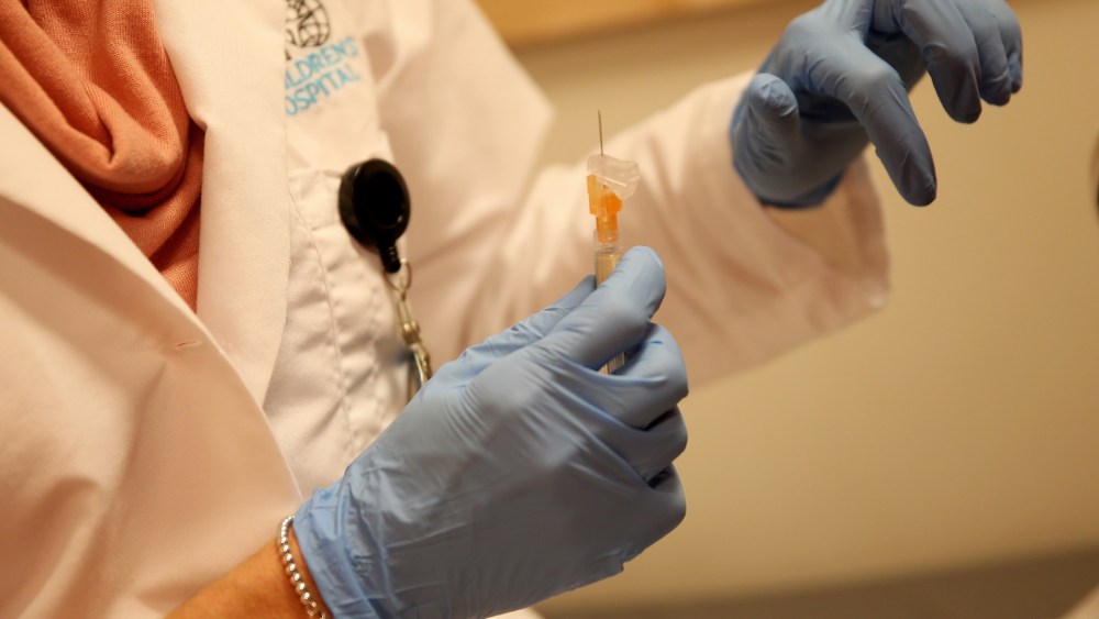 Miami Children's Hospital pediatrician Dr. Amanda Porro, M.D prepares to administer a measles vaccination to a child at the Miami Children's Hospital on Jan. 28, 2015 in Miami, Fla. (Photo by Joe Raedle/Getty)