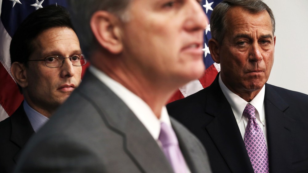Kevin McCarthy, John Boehner, and Eric Cantor listen during a news briefing on Jan. 14, 2014.