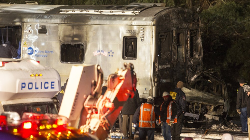 Metropolitan Transportation Authority (MTA) workers and police investigate a Metro-North train crash on Feb. 3, 2015 in Valhalla, N.Y. (Photo by Michael Graae/Getty)