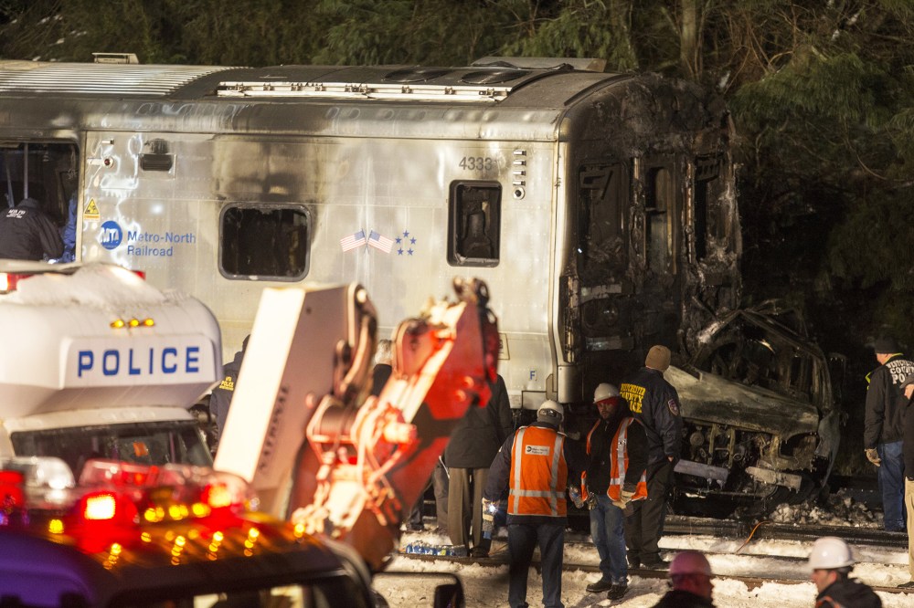 Metropolitan Transportation Authority (MTA) workers and police investigate a Metro-North train crash on Feb. 3, 2015 in Valhalla, N.Y. (Photo by Michael Graae/Getty)