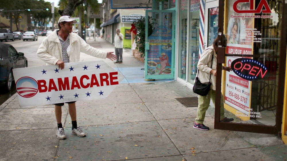 Pedro Rojas holds a sign directing people to an insurance company where they can sign up for the Affordable Care Act, also known as Obamacare, before the February 15th deadline on Feb. 5, 2015 in Miami, Fla.