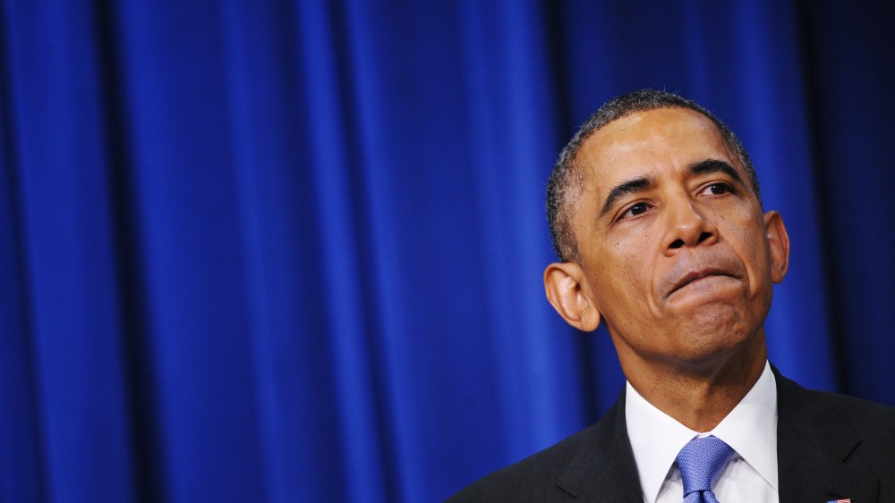 Obama pauses as he speaks during an event on expanding college opportunity, Jan. 16, 2014.
