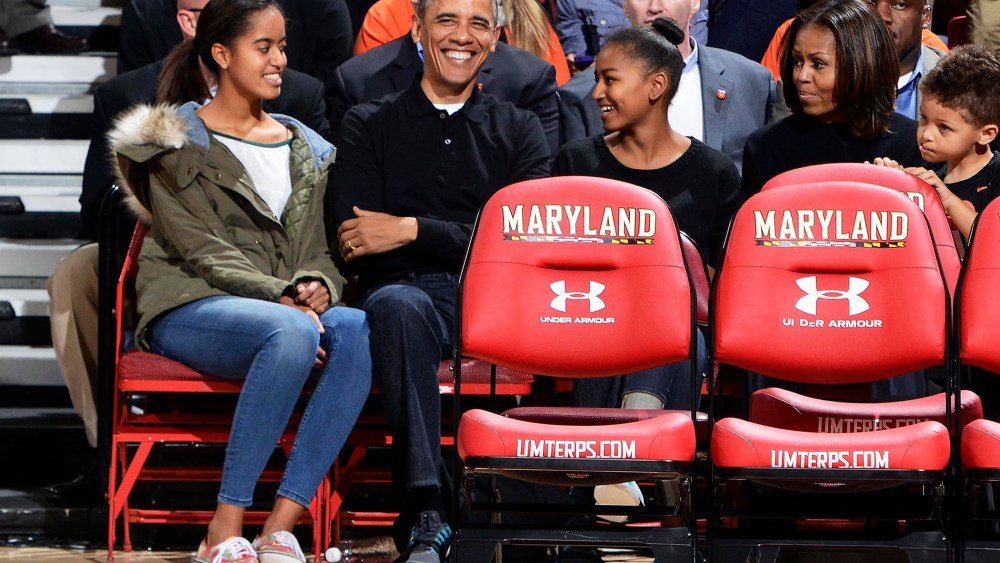 President Obama and his family watch a college basketball game between the Oregon State Beavers and the Maryland Terrapins, Nov. 17, 2013.