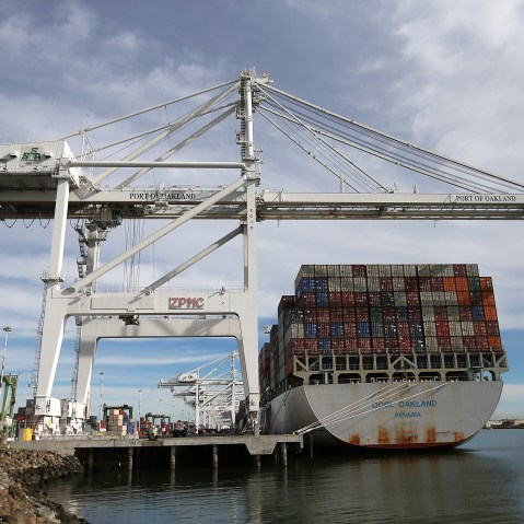 A container ship sits docked in a berth at the Port of Oakland on Feb. 11, 2015 in Oakland, Calif. (Photo by Justin Sullivan/Getty)