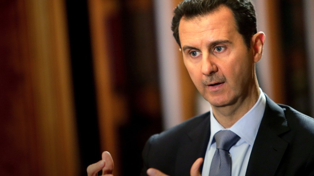 In a picture released on January 20, 2014, Syrian President Bashar al-Assad speaks during an interview with AFP at the presidential palace in Damascus. (Photo by Joseph Eid/AFP/Getty)