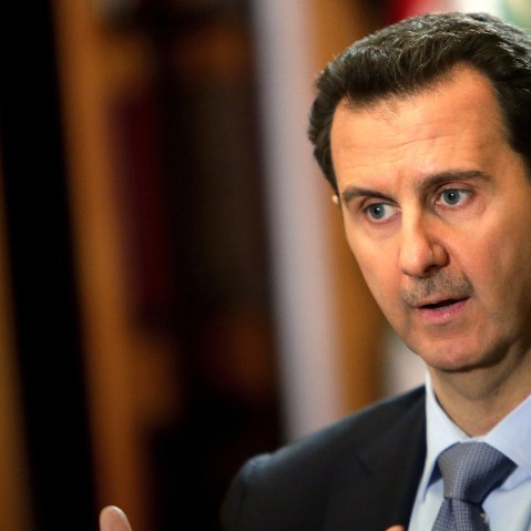 In a picture released on January 20, 2014, Syrian President Bashar al-Assad speaks during an interview with AFP at the presidential palace in Damascus. (Photo by Joseph Eid/AFP/Getty)