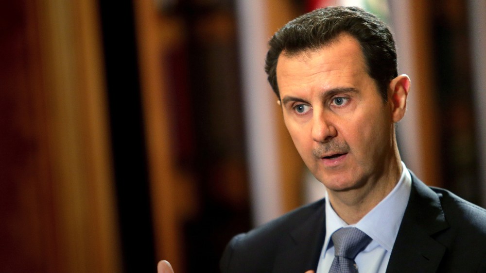 In a picture released on January 20, 2014, Syrian President Bashar al-Assad speaks during an interview with AFP at the presidential palace in Damascus. (Photo by Joseph Eid/AFP/Getty)