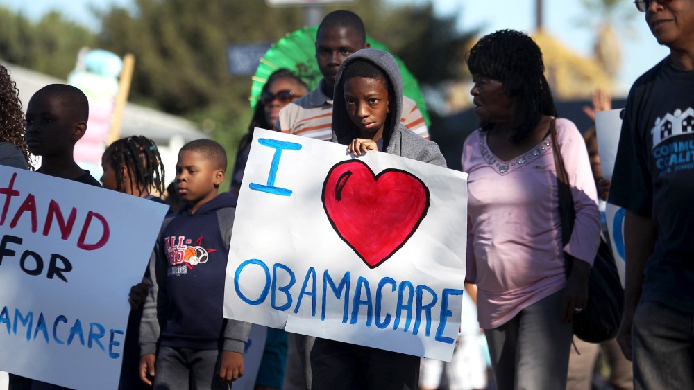 Supporters of the Affordable Care Act march in the 29th annual Kingdom Day Parade on January 20, 2014 in Los Angeles, California.