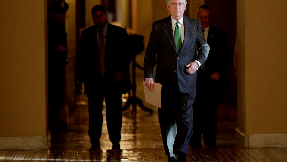 Senate Majority Leader Mitch McConnell (R-KY) walks from his office in the U.S. Capitol to the Senate chamber to open debate on a funding bill for the Department of Homeland Security on Feb. 23, 2015 in Washington, DC.