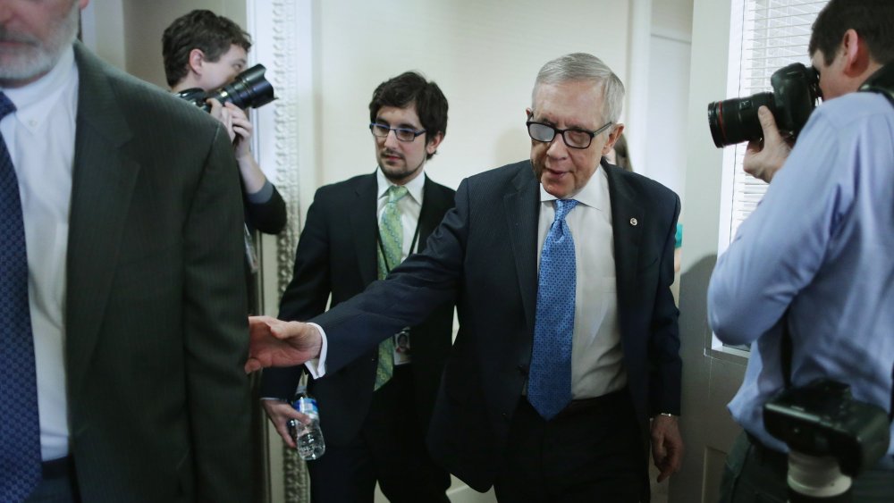 Senate Minority Leader Harry Reid (D-NV) leaves a news conference in the Radio Television Gallery at the U.S. Capitol on Feb. 26, 2015 in Washington, DC. (Photo by Chip Somodevilla/Getty)