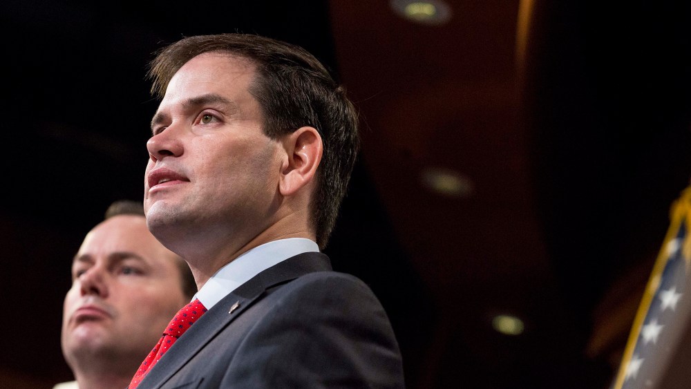 Sen. Marco Rubio (R-FL) speaks next to Sen. Mike Lee (R-Utah) during a news conference to introduce their proposal for an overhaul of the tax code, March 4, 2015 on Capitol Hill in Washington, DC. (Photo by Drew Angerer/Getty)