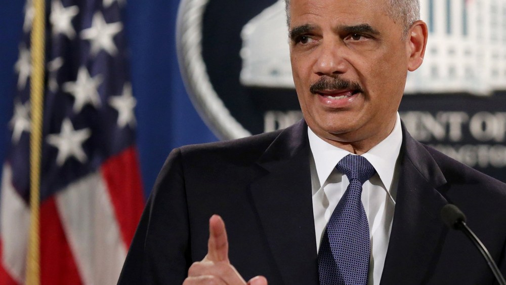 Attorney General Eric Holder delivers remarks about the Justice Department's findings related to two investigations in Ferguson, Mo. at the Robert F. Kennedy Department of Justice Building on March 4, 2015 in Washington, DC.