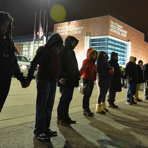 Protestors demonstrate outside the Ferguson Police Department in Ferguson, Missouri on March 4, 2015. (Photo by Michael B. Thomas/Getty)