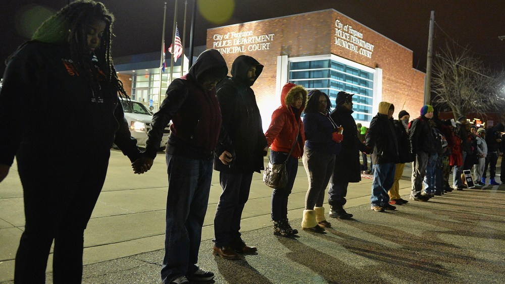 Protestors demonstrate outside the Ferguson Police Department in Ferguson, Missouri on March 4, 2015. (Photo by Michael B. Thomas/Getty)