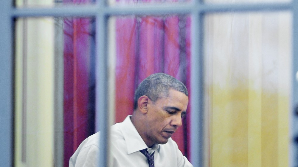 Barack Obama works in the Oval Office of the White House, Jan. 27, 2014.