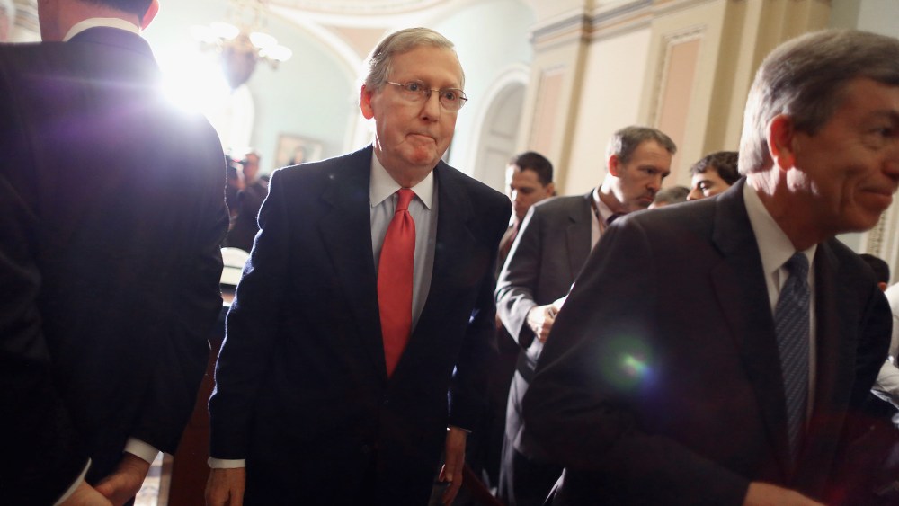 Mitch McConnell leaves after talking with reporters at the U.S. Capitol, Jan. 28, 2014.