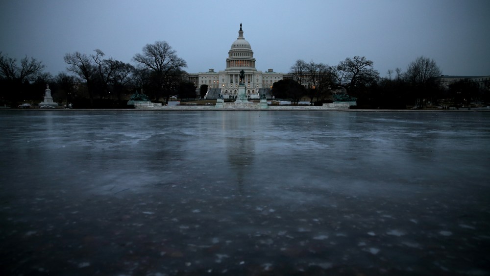 The Capitol Reflecting Pool is frozen in front of the U.S. Capitol on Jan. 28, 2014 in Washington, DC.
